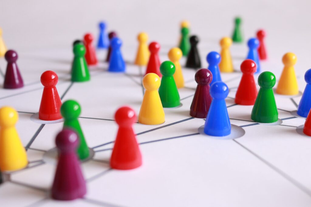 A group of colorful wooden figures in a network.