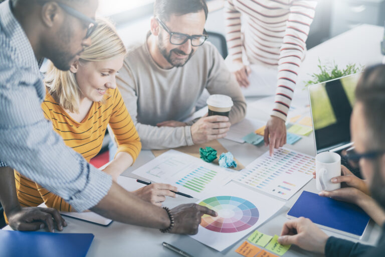 A group developing a strategic marketing budget plan.