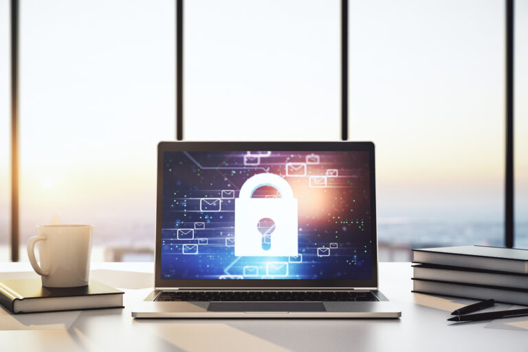 Balancing Customer Privacy Through Analytics and Experience: A laptop on a desk secured with a padlock.