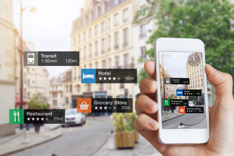 A person is holding up a smartphone with a map of a city on it.
