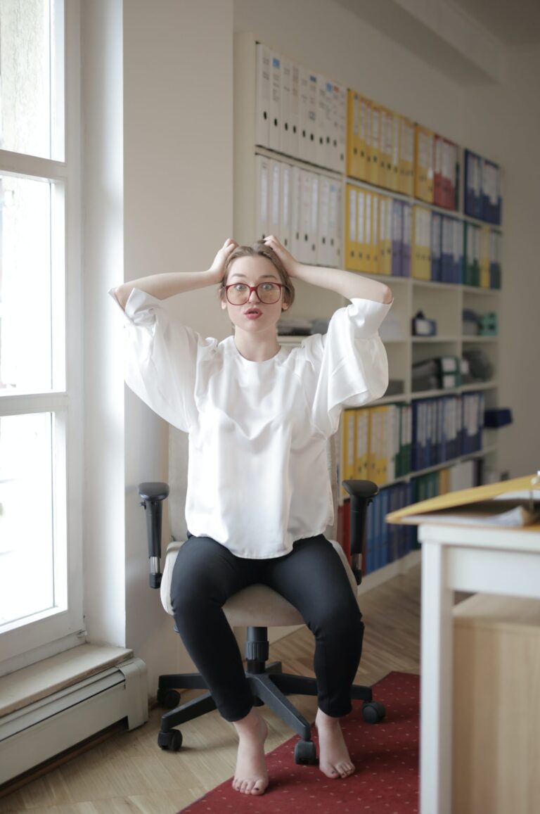 A woman sitting on an office chair while navigating digital marketing attribution and optimization.