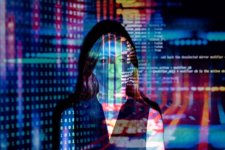 An image of a woman utilizing machine learning in marketing to analyze data on a computer screen.